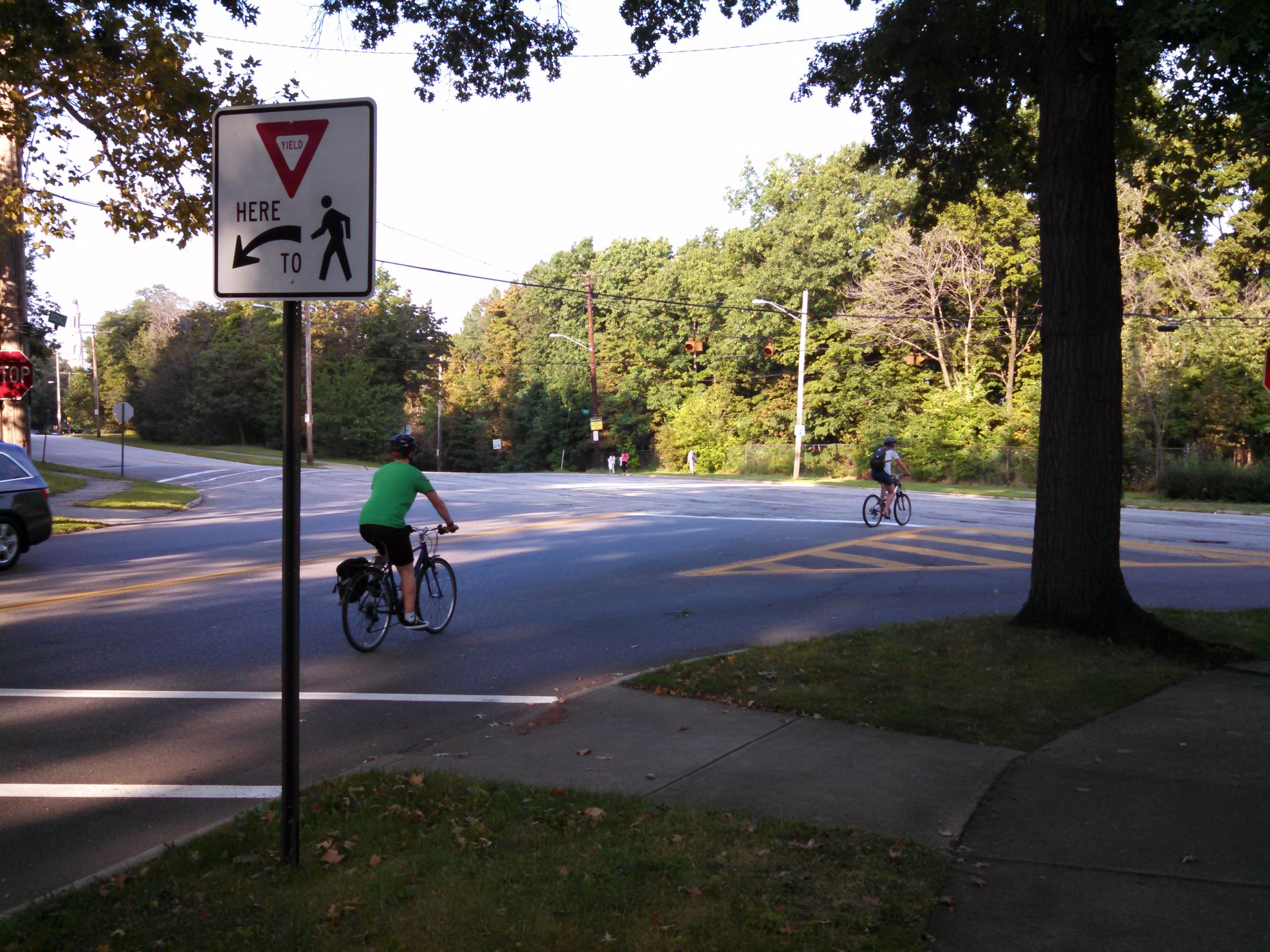Two bicyclists at an intersection in Cleveland Heights. 