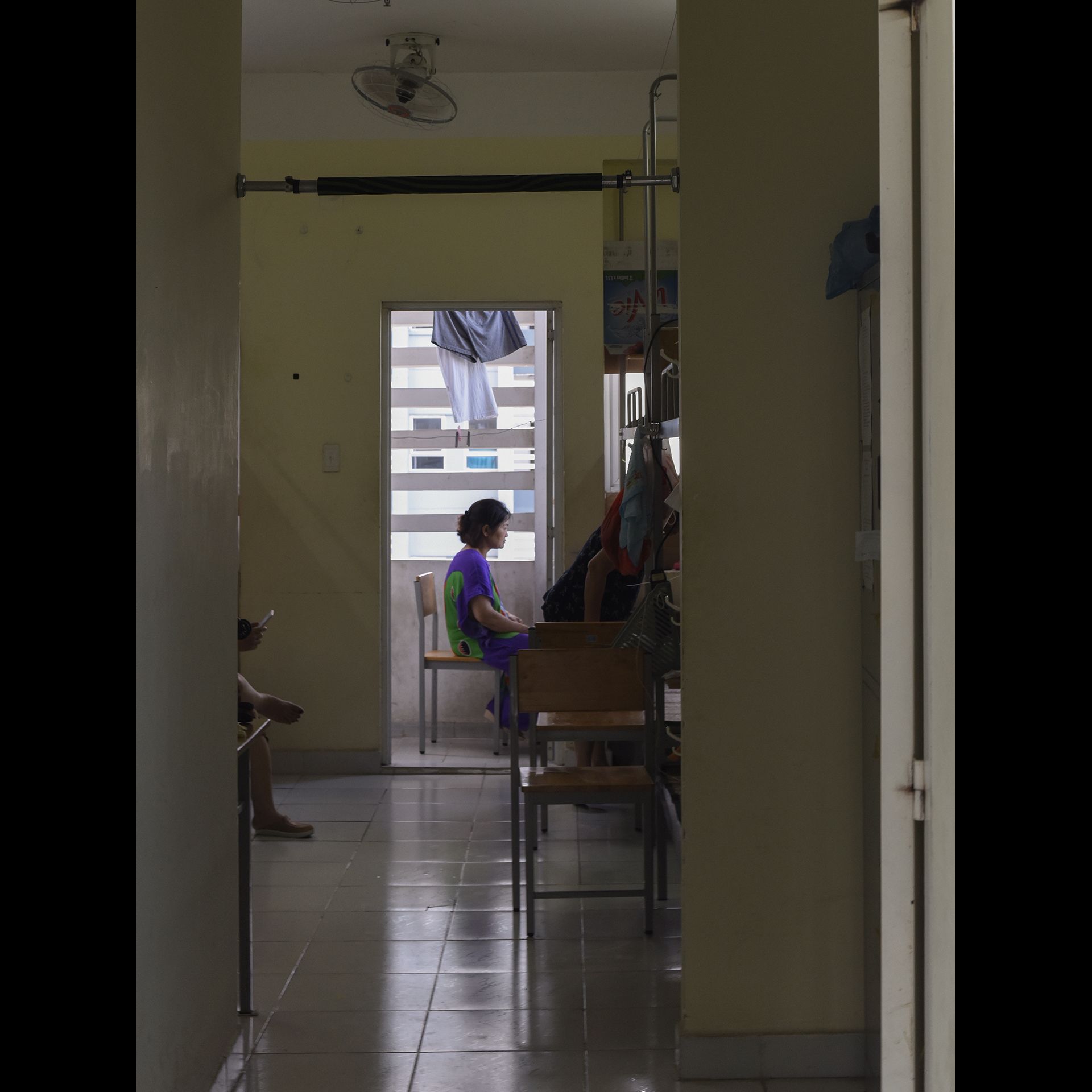 A woman isolates in quarantine during the coronavirus pandemic in Vietnam, April 2020. [Pipo Nguyen-duy]