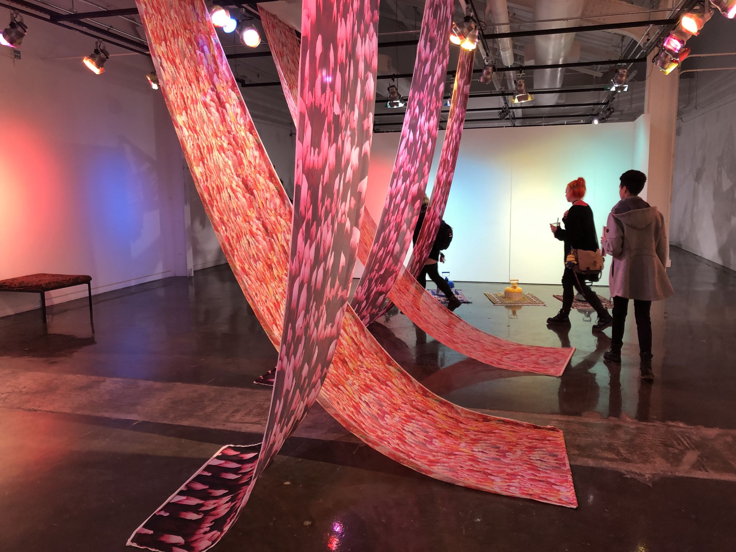 "PrÆy and Azar," are silk banners featuring images of women wearing hijabs. 2019 [Omid Tavakoli]