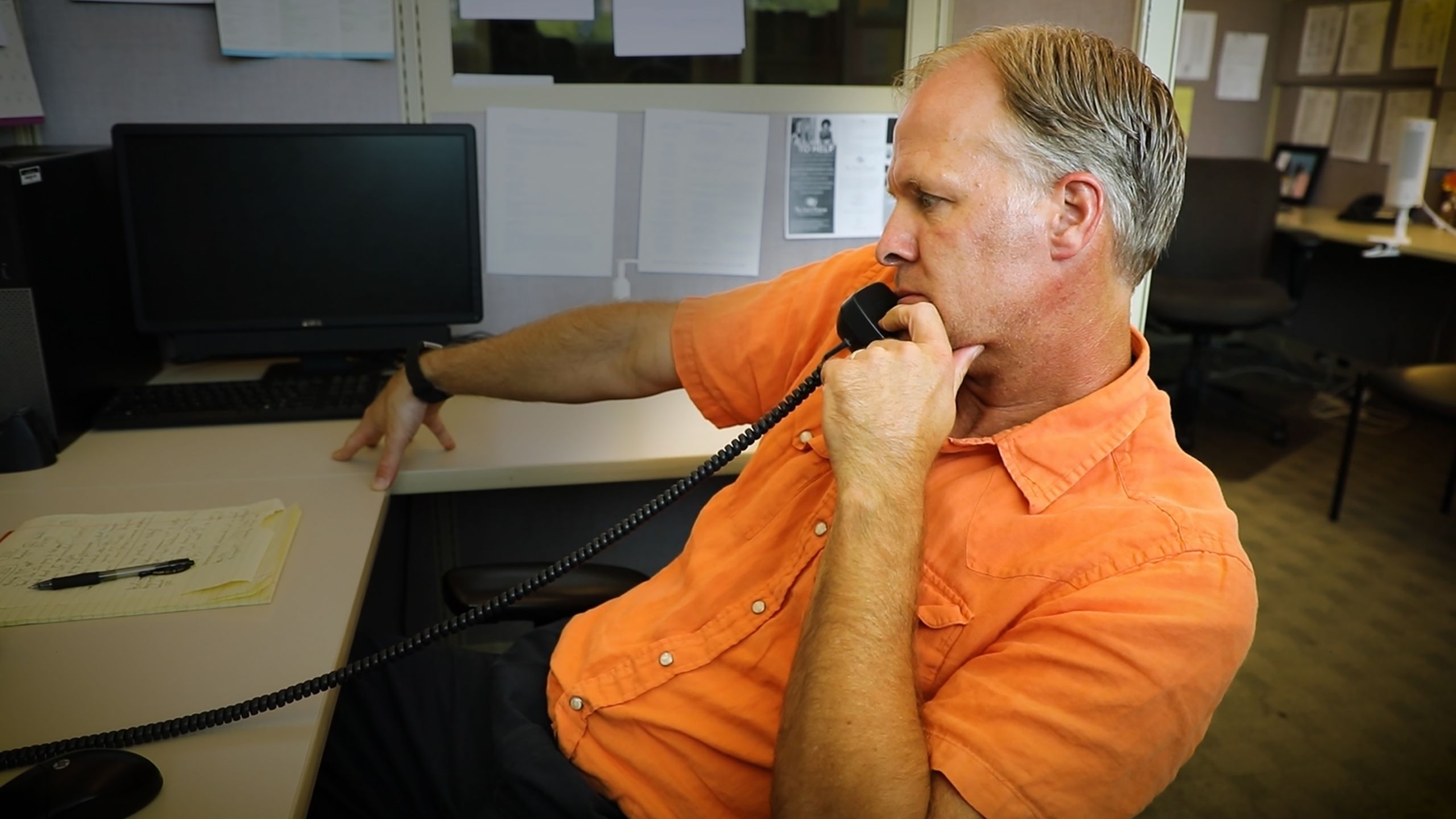 Crisis Intervention Specialist John Rudolph answers a call for Frontline Service's crisis hotline.