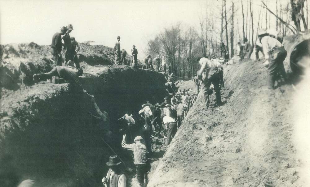 Archive photo of workers in Akron digging the main trench of a water transmission line circa 1912