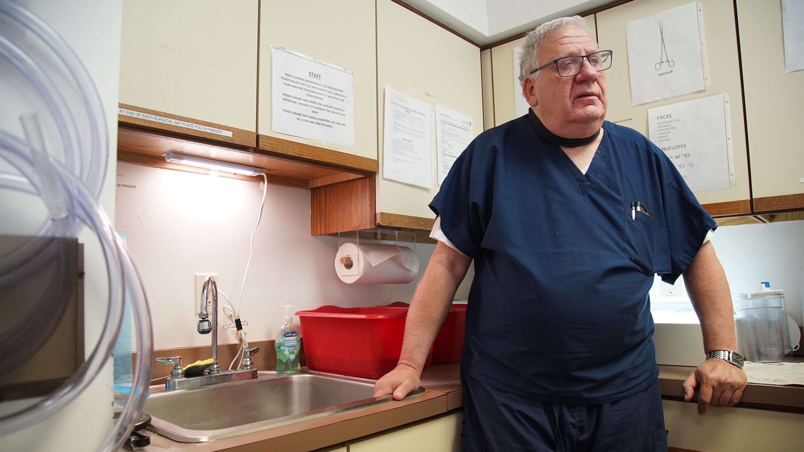 Dr. David Burkons leans against the counter at the Northeast Ohio Women’s Center in Cuyahoga Falls, Ohio.