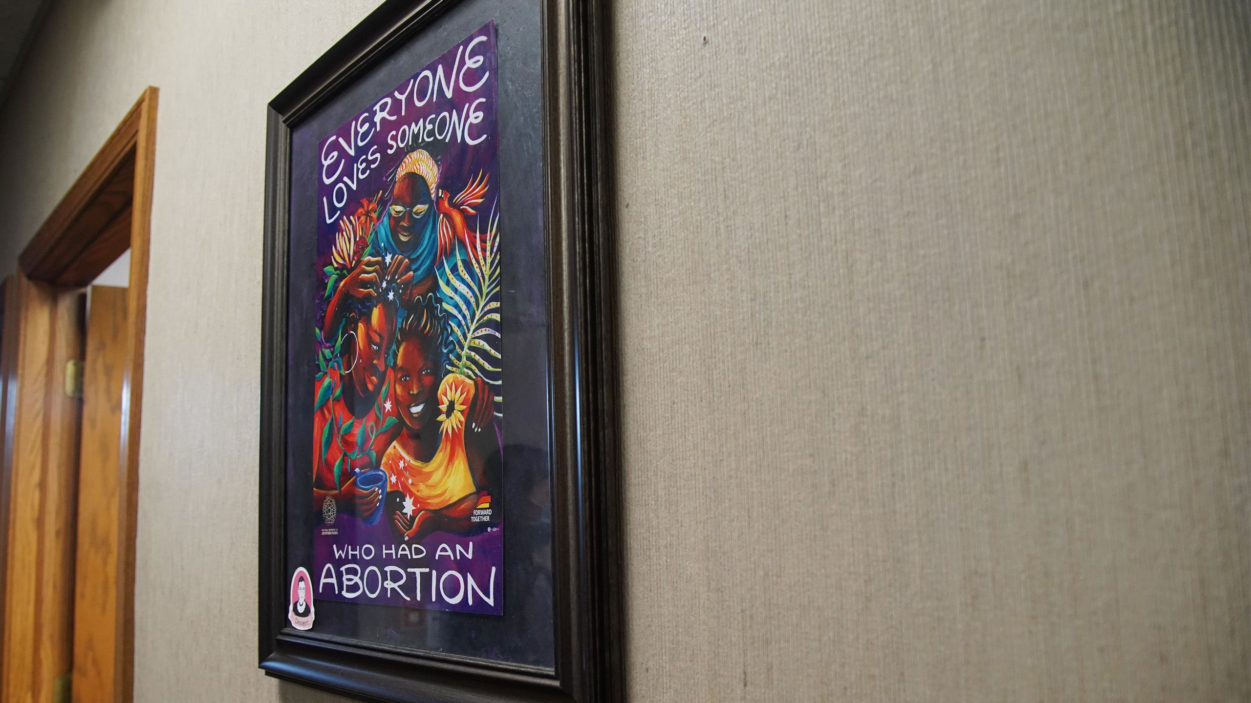 Artwork reading, "Everyone loves someone who had an abortion," hangs inside the Northeast Ohio Women's Center in Cuyahoga Falls.