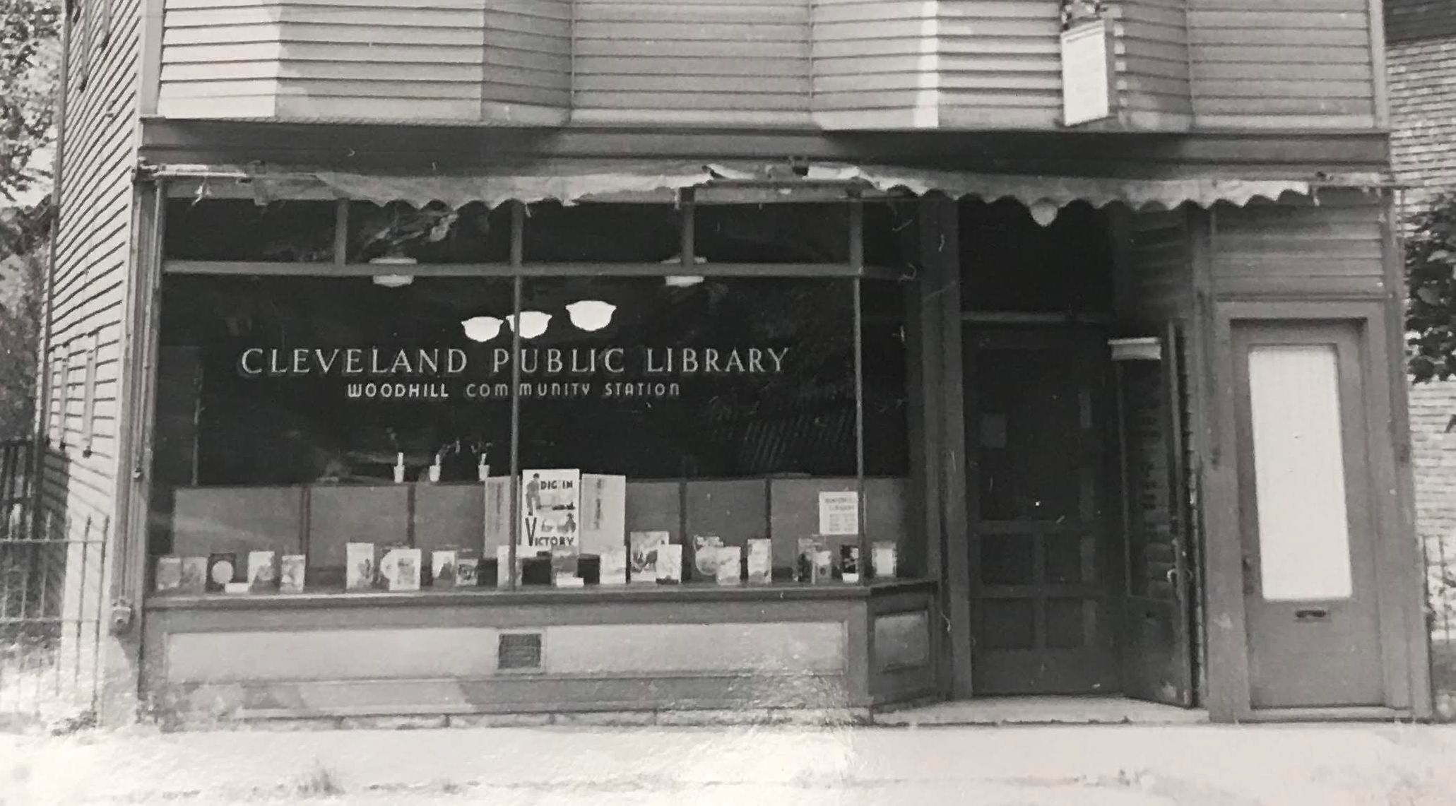 A photo shows a historic library branch near Woodhill Homes.
