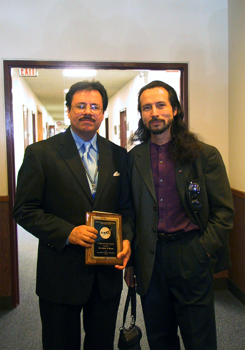 Rivera-Resto poses with his brother Ricky at a NASA awards ceremony. The brothers lived together in the early Cleveland days and have remained partners in a number of art projects