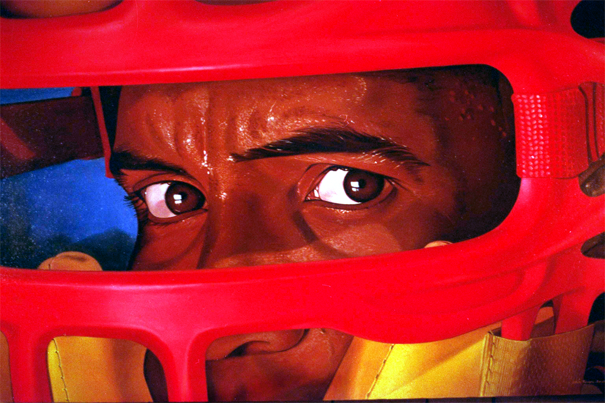 Indians catcher Sandy Alomar eyes peer out of his mask with a combination of concern and determination [courtesy: John Rivera-Resto]