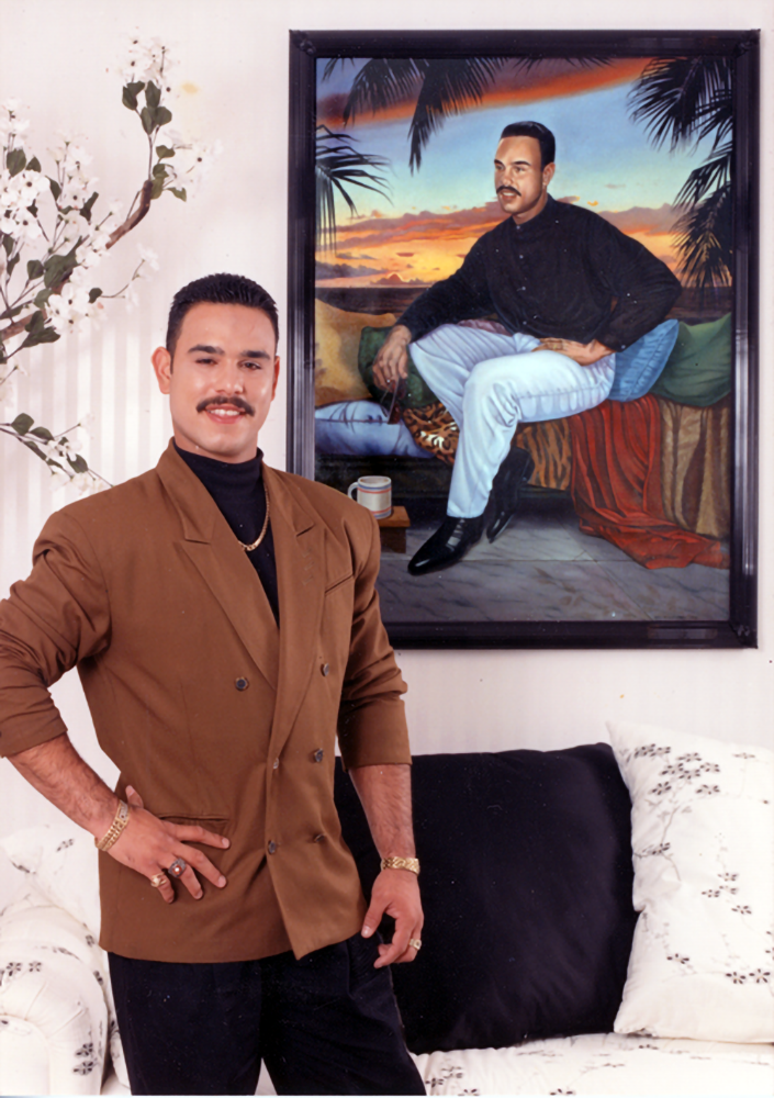 Carlos Baerga poses by his Rivera-Resto portrait.