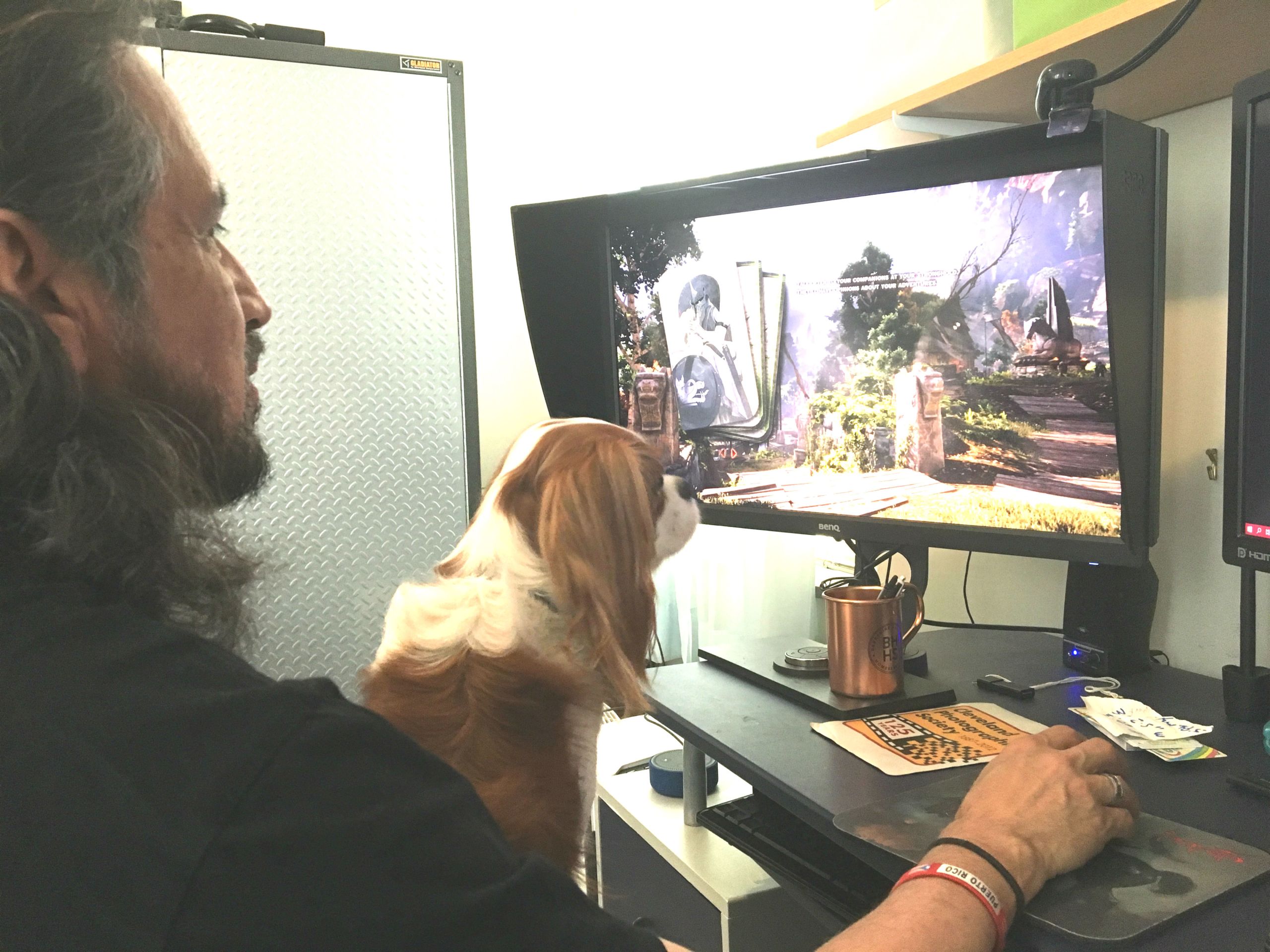 With his dog Charlie in his lap, Rivera-Resto takes a break with a video game.